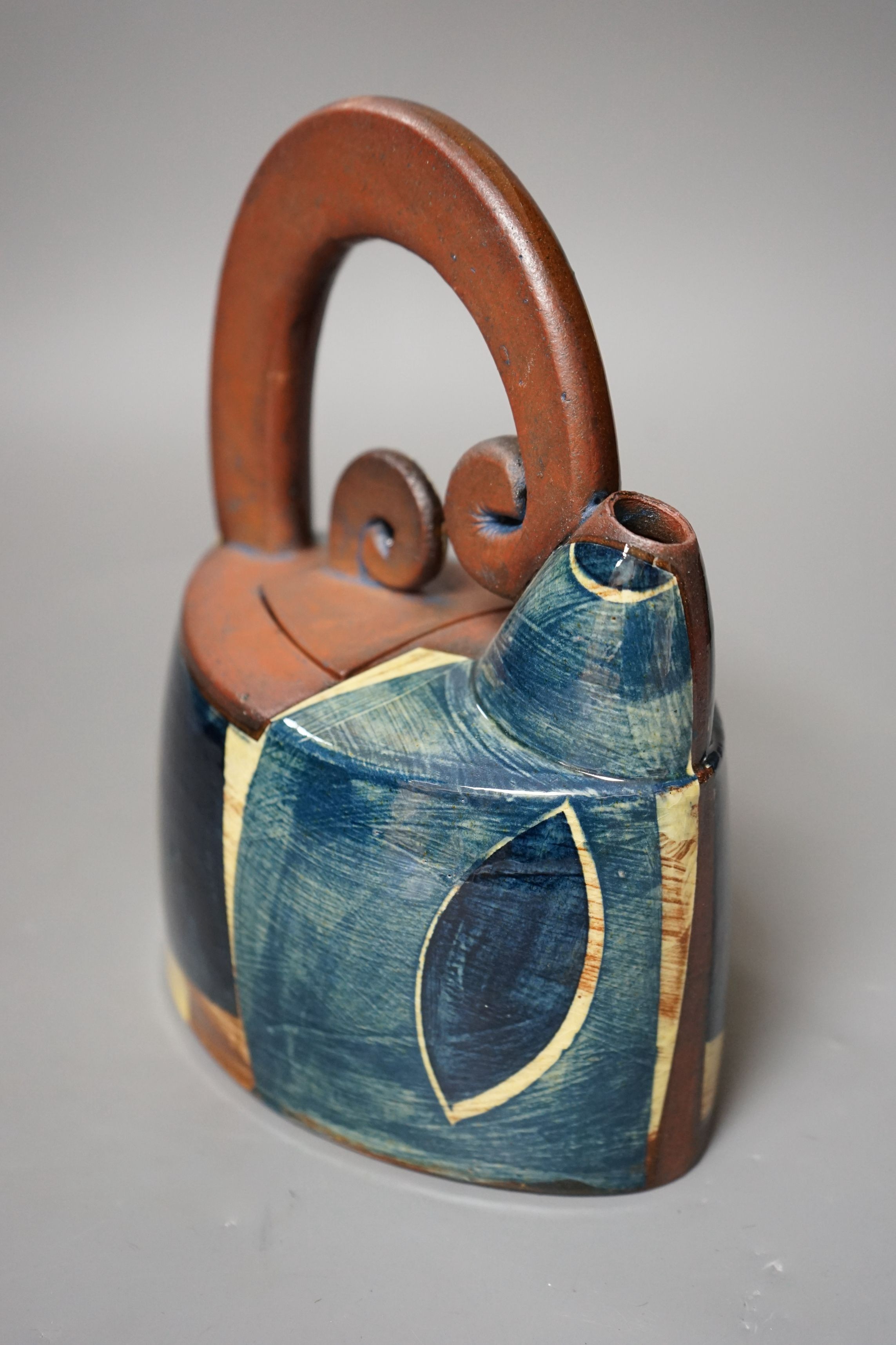 Richard Phethean (b.1953), an abstract green yellow and blue glazed earthenware teapot, purchased from Craft Potters Association contemporary ceramics centre, 63 Great Russell Street, London, 23cm tall